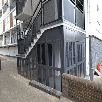 PORTCULLIS STEEL COMMUNAL ENTRANCE DOOR SET. LPS1175 SR2 SBD Secure by Design accredited communal security door installation with steel frame and glass panels, enhancing safety and aesthetics in residential building.