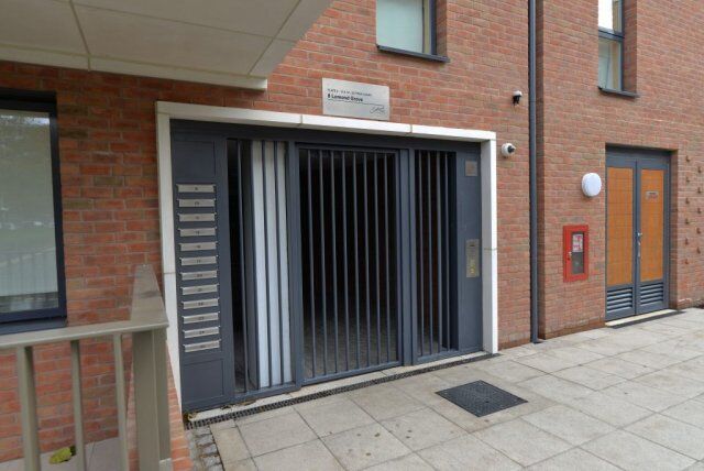 Secure by Design accredited communal mailbox installation with steel security door and access control, showcasing durability and safety features.