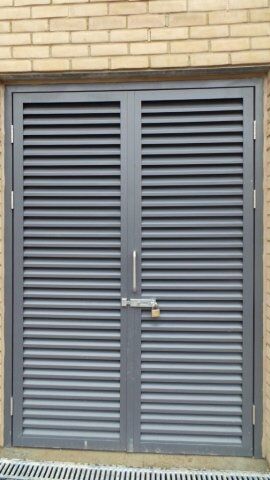 Secure by Design accredited louvre security door with a padlock, showcasing durability and strength for enhanced safety in residential and commercial properties.