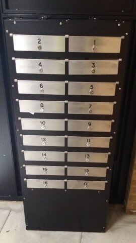 Mailboxes featuring numbered metal plates, designed for secure residential or communal access, reflecting the high-security standards of Secure by Design products.