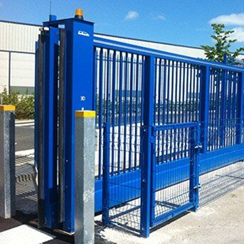 Blue security gate with vertical bars and automated opening mechanism, designed for enhanced safety in residential and commercial properties, showcasing Secure by Design accreditation.